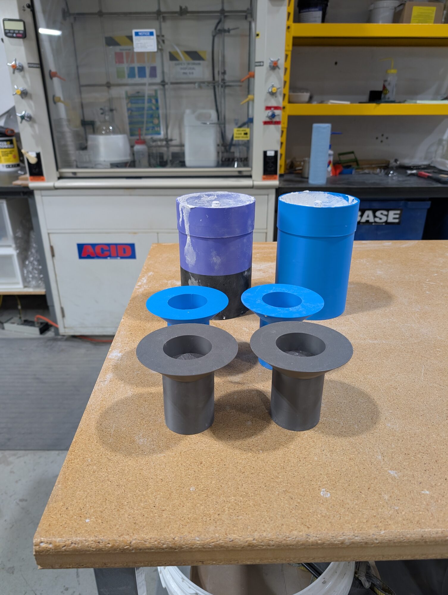 Two molds and two finished flanged parts on the bench
