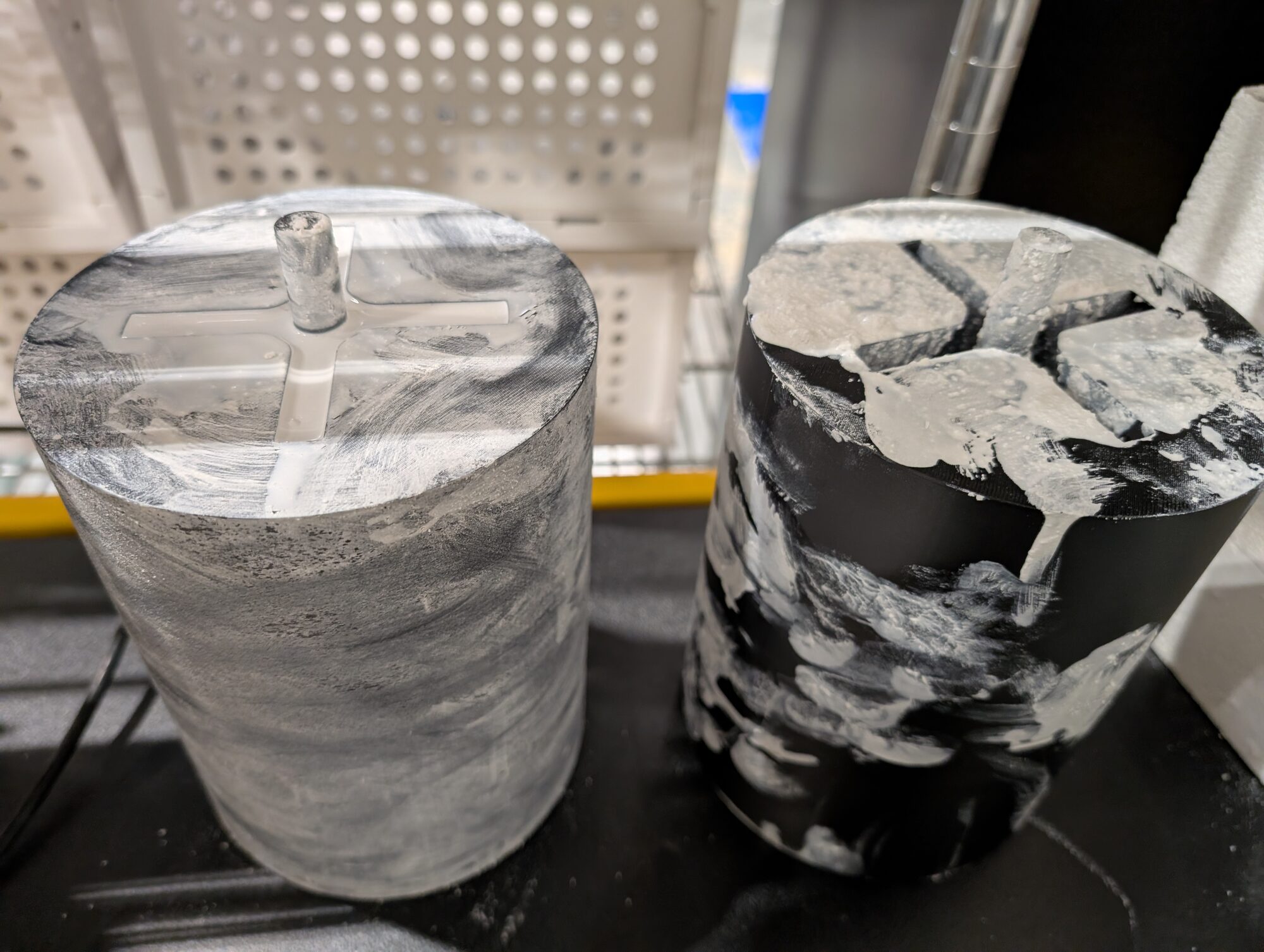 Two printed cylindrical molds with cross-web formers and center pins