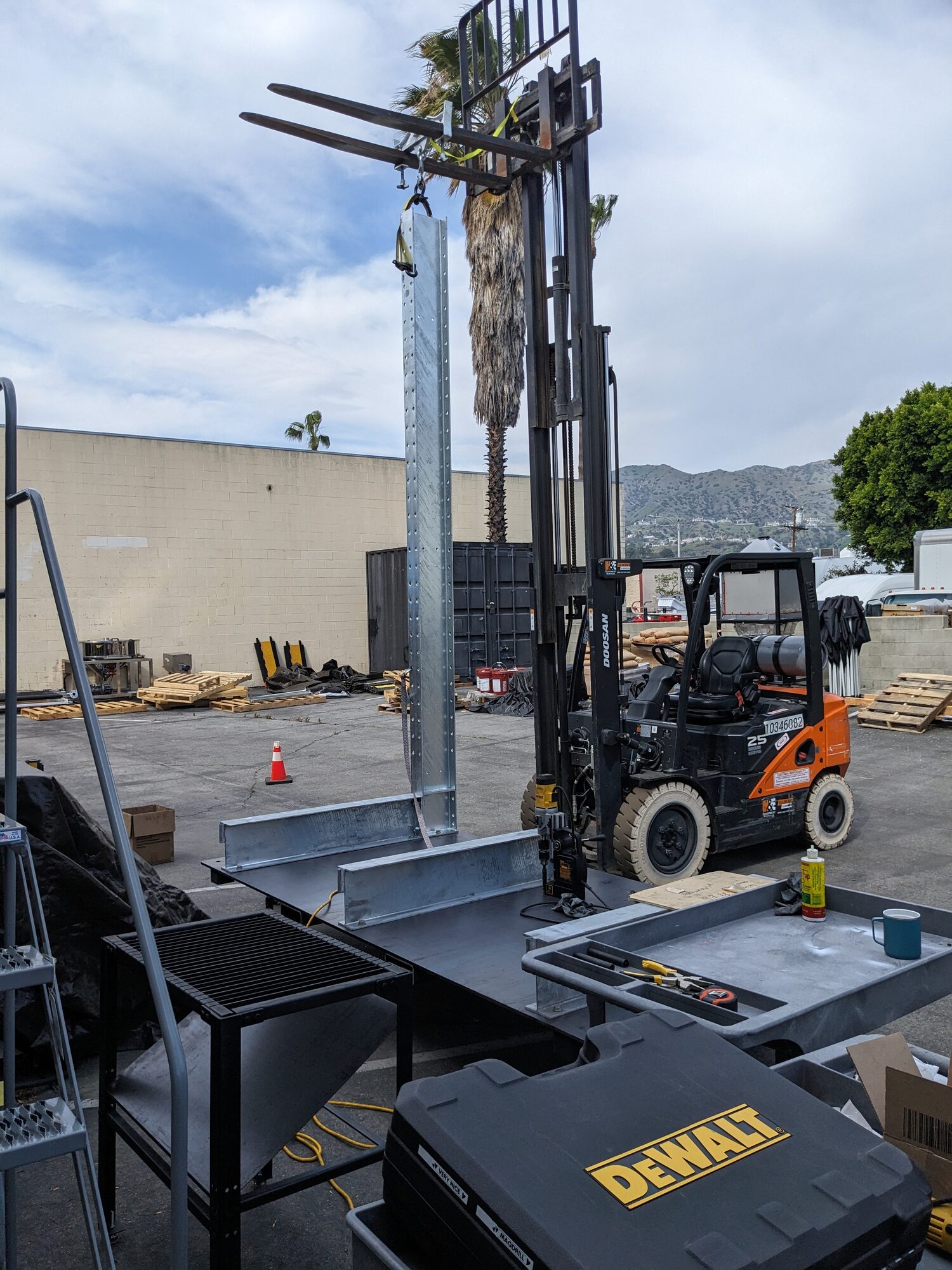 Forklift lifting a frame post