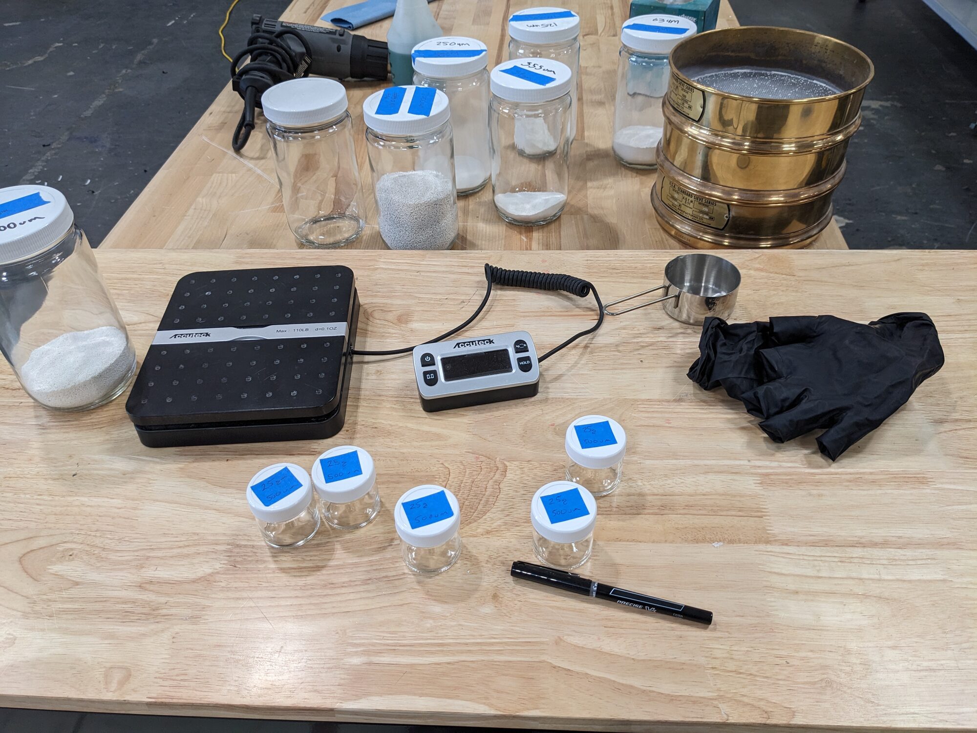 Sample jars, scale, and sieve stack
