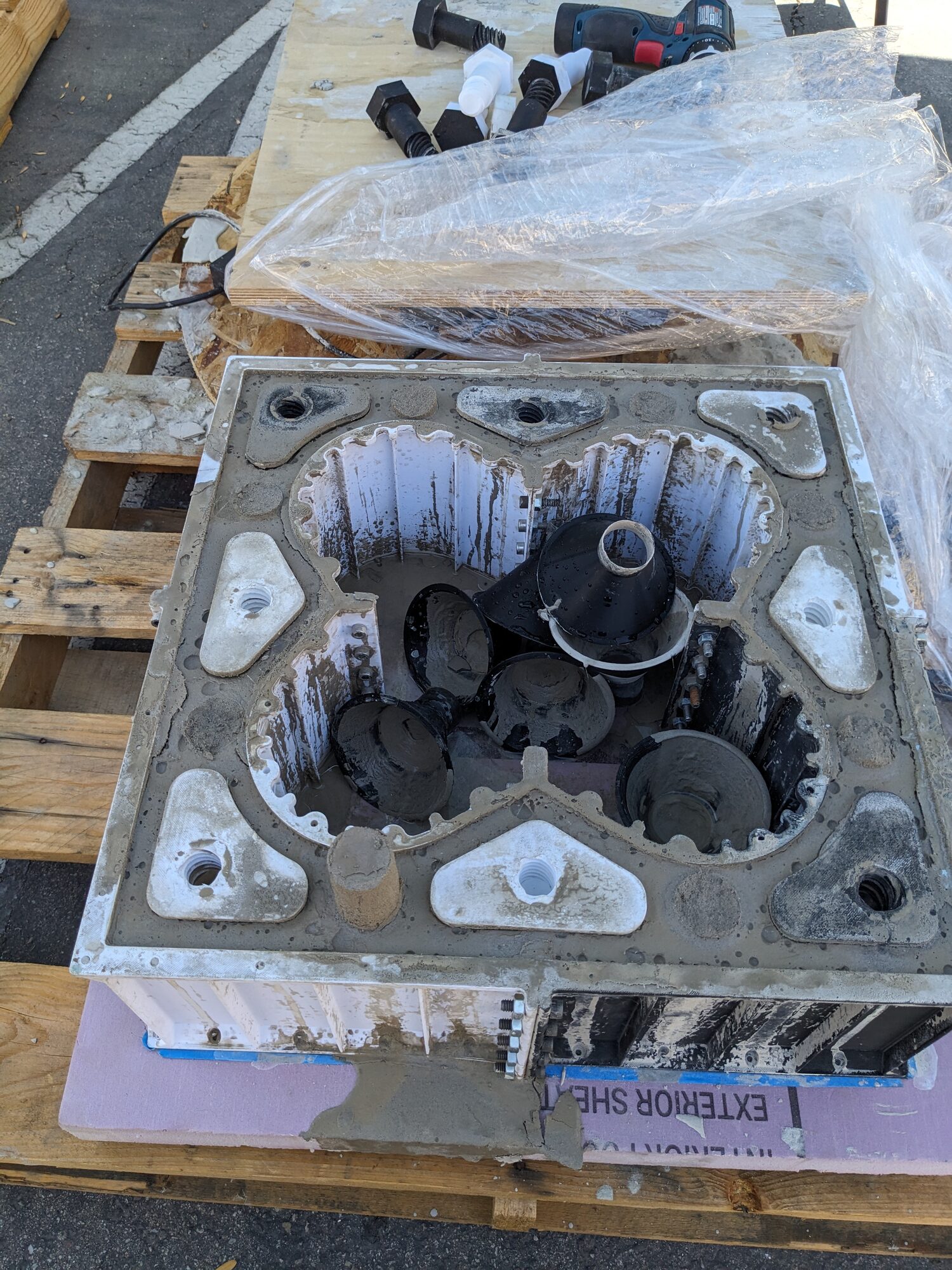 Block on a pallet with plates and black formers still in place