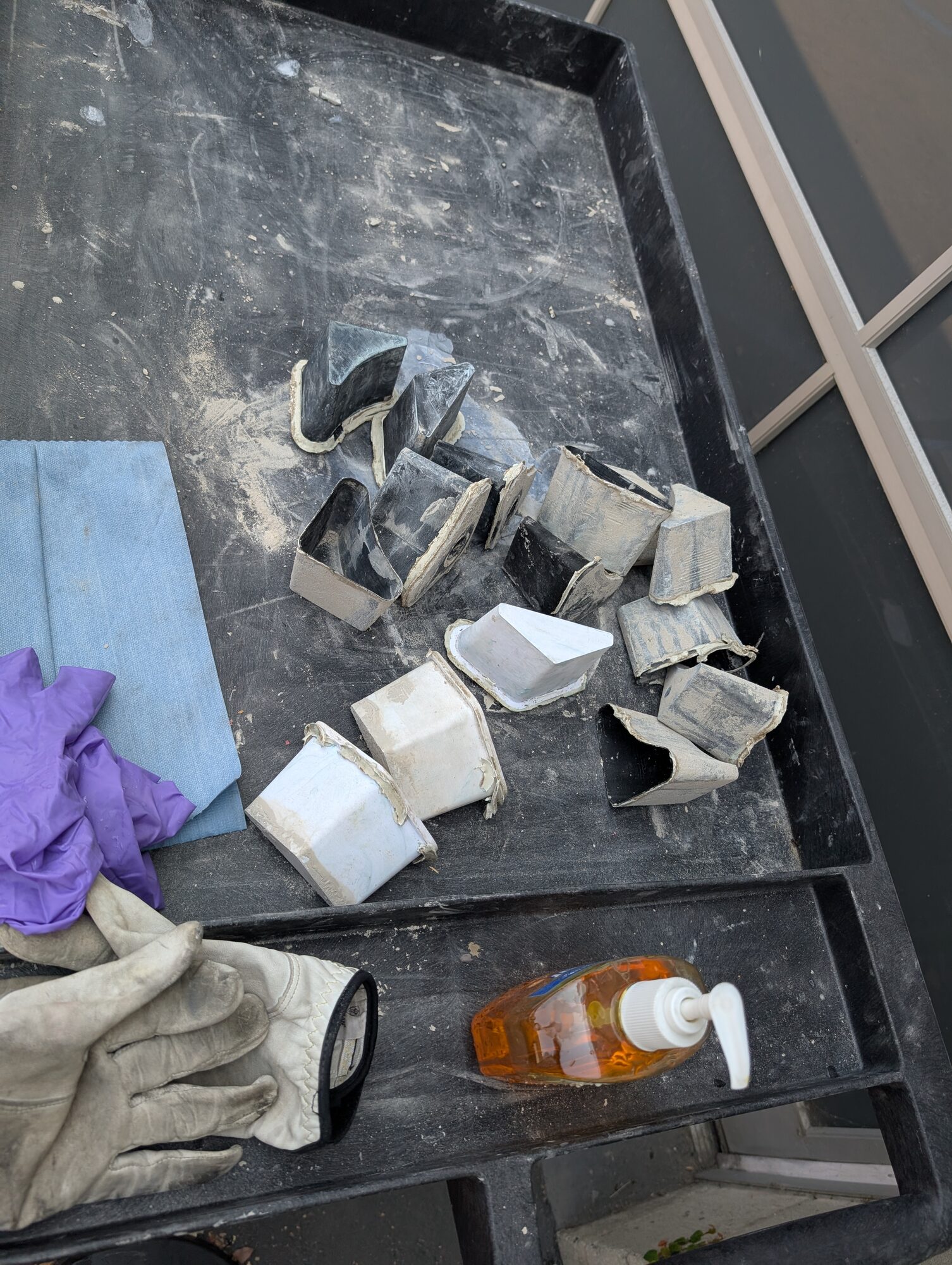 Demolded sleeves in a black tray