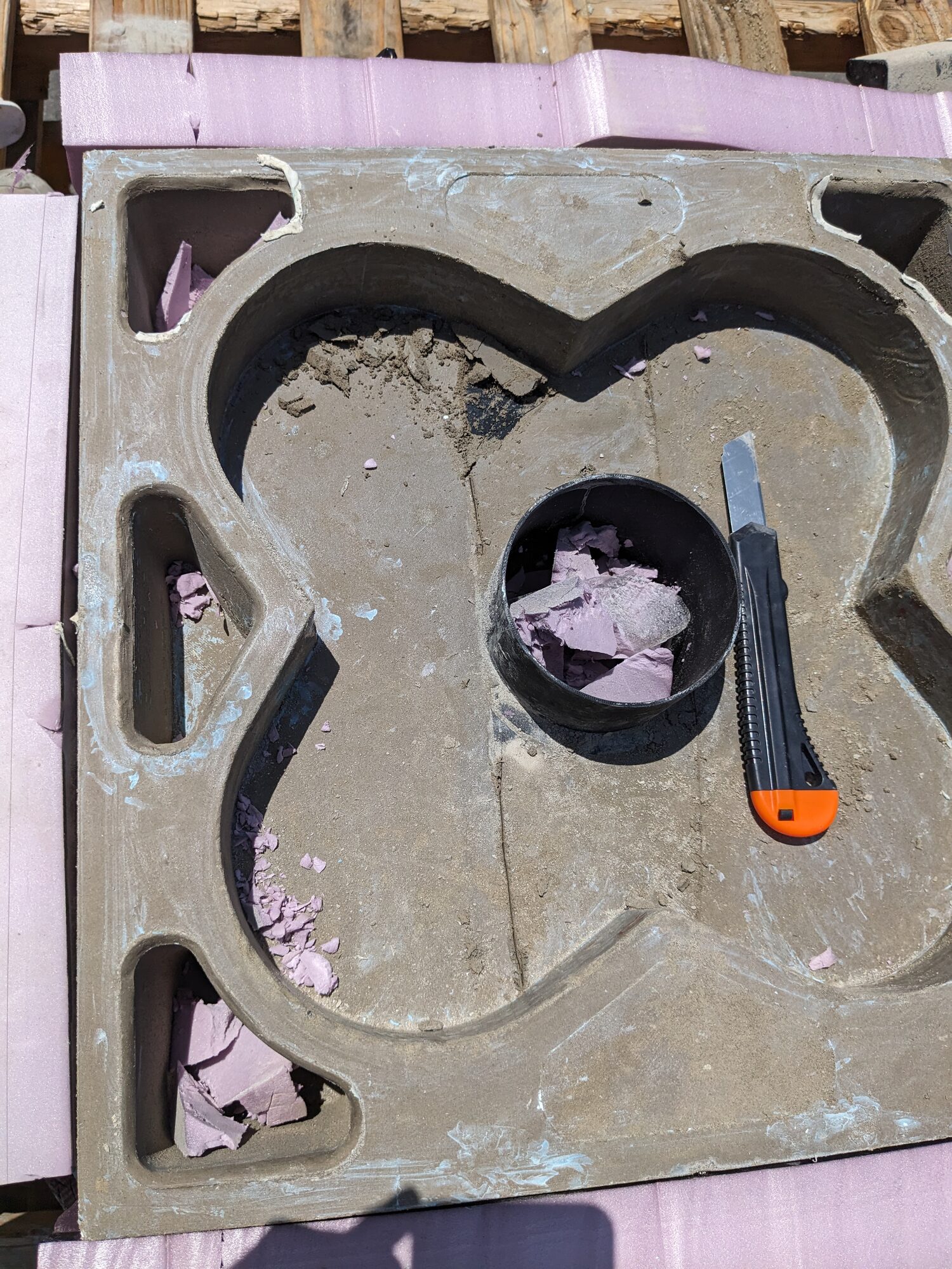 Foam remnants inside the void being cut out with a utility knife