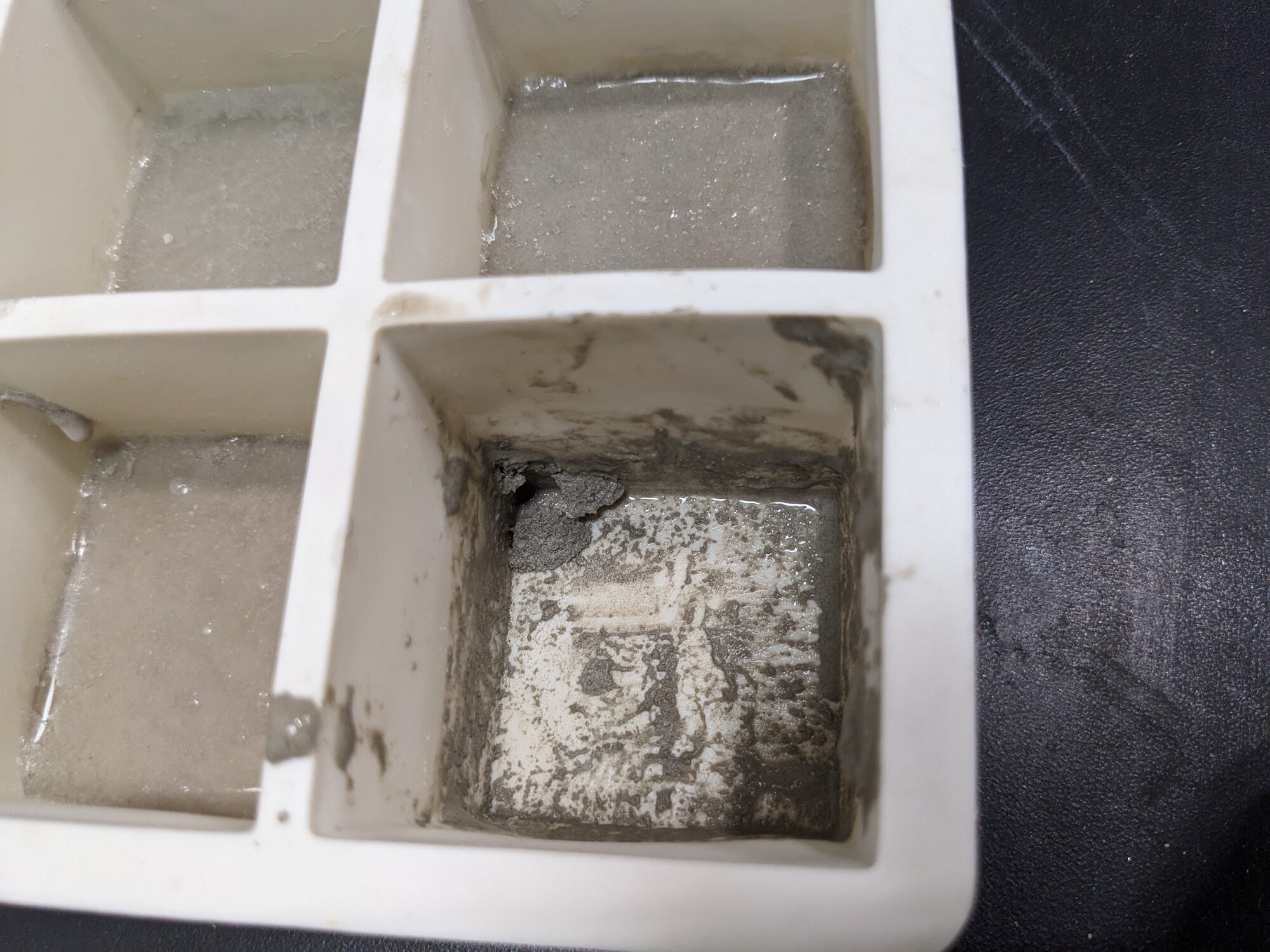 Refractory slurry in the cells of a silicone ice cube tray