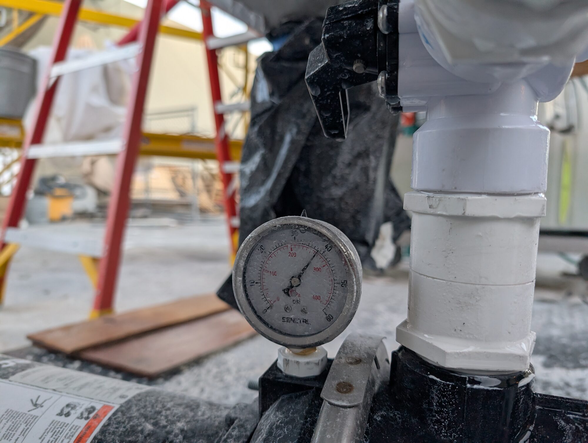 A pressure gauge reading on the pump discharge